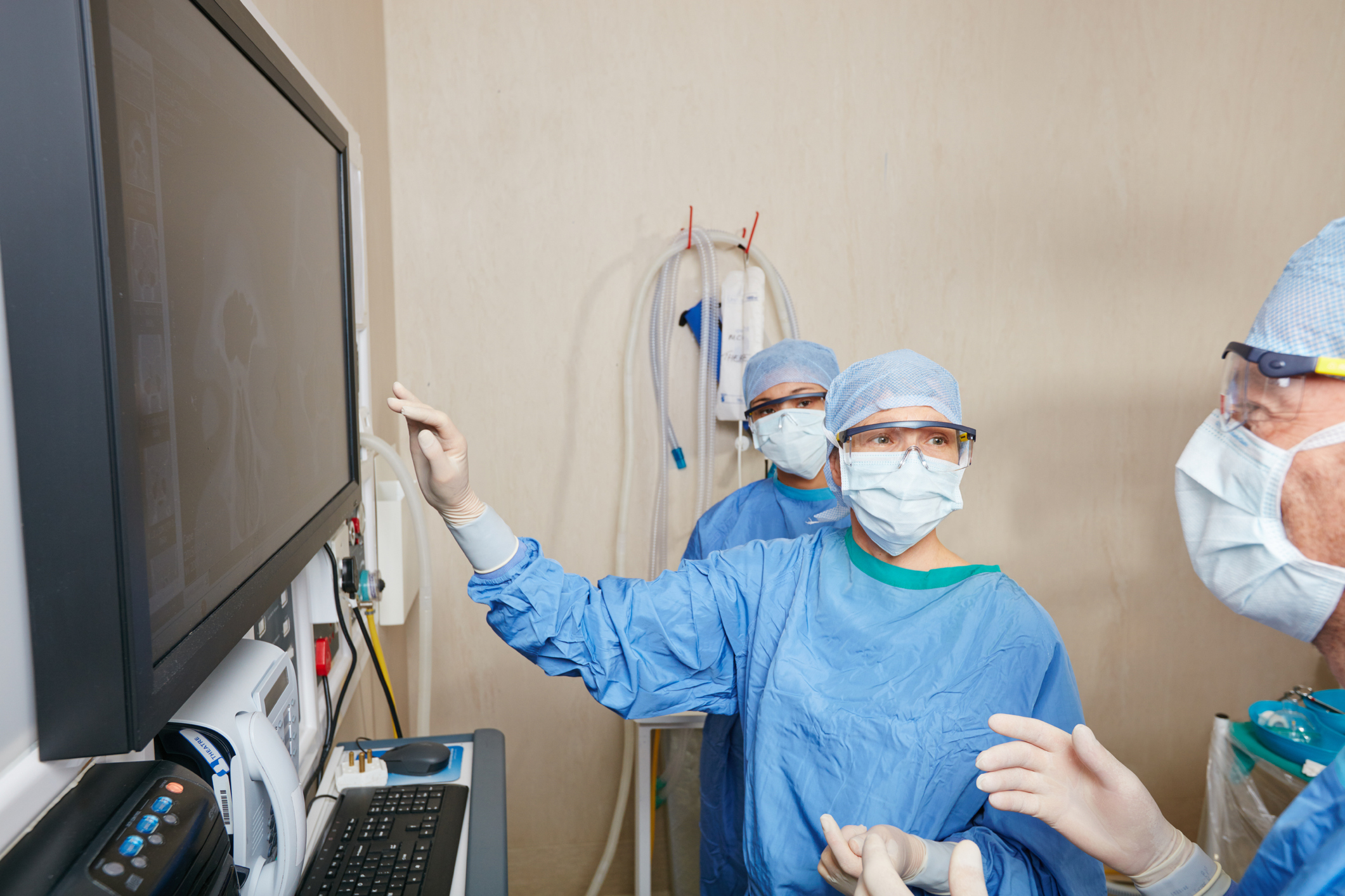 Shot of a team of surgeons and students discussing a patient’s medical scans