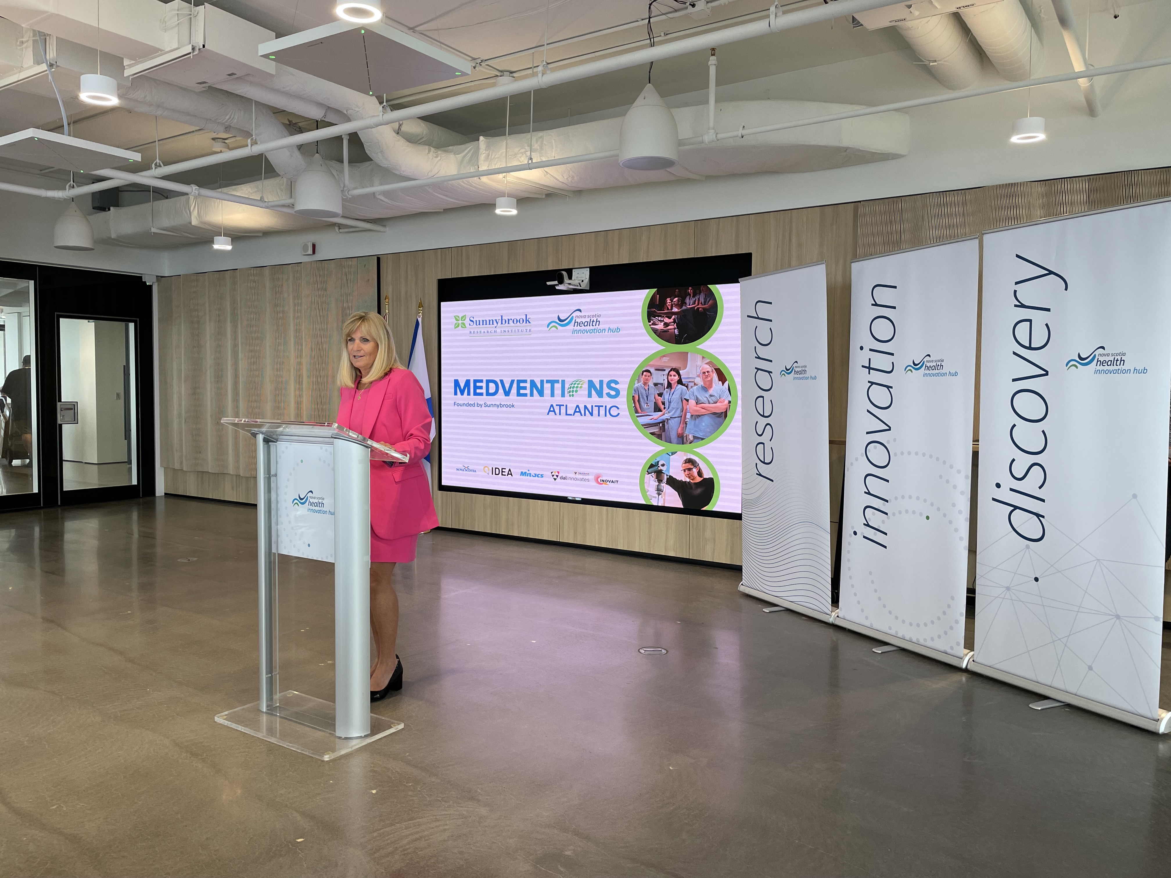 Gail Tomblin Murphy standing at a podium