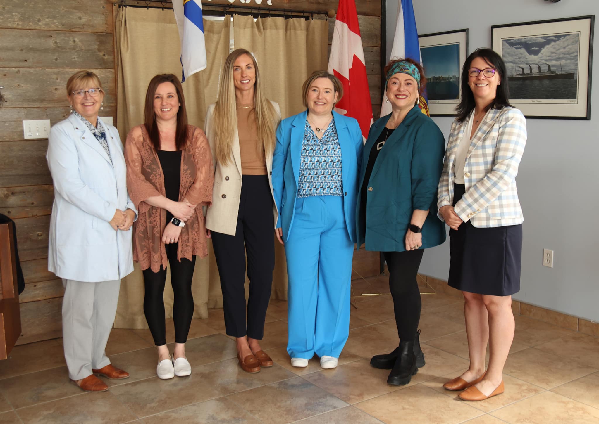 Pictured from L-R: Minister Barbara Adams; Erica Kerfont, Jessica Myers and Erin Sarrazin from Eastern Passage Family Practice; Dr. Maria Alexiadis; and Minister Michelle Thompson.