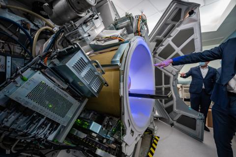 A hand pointing to a new radiation machine