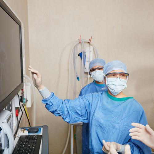 Shot of a team of surgeons and students discussing a patient’s medical scans