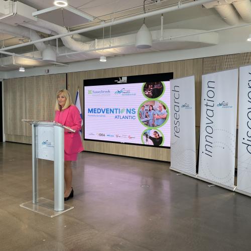 Gail Tomblin Murphy standing at a podium