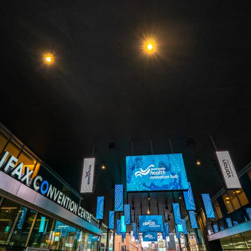 An tv screen at the Halifax Convention Centre says Nova Scotia Health Innovation Hub