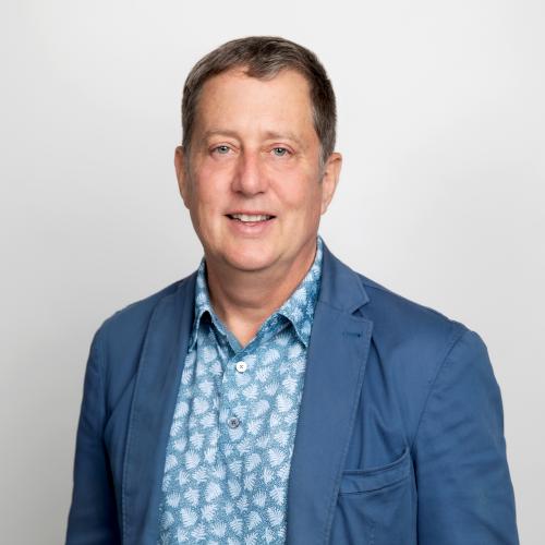 Headshot of Dr. Howlett wearing a blue blazer