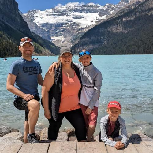 A photo of patient Ryan Deveau and his family at a lake.